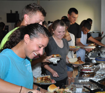 Students prepare food together