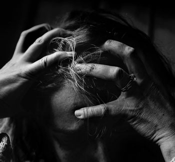 Black and white photo of a frustrated woman